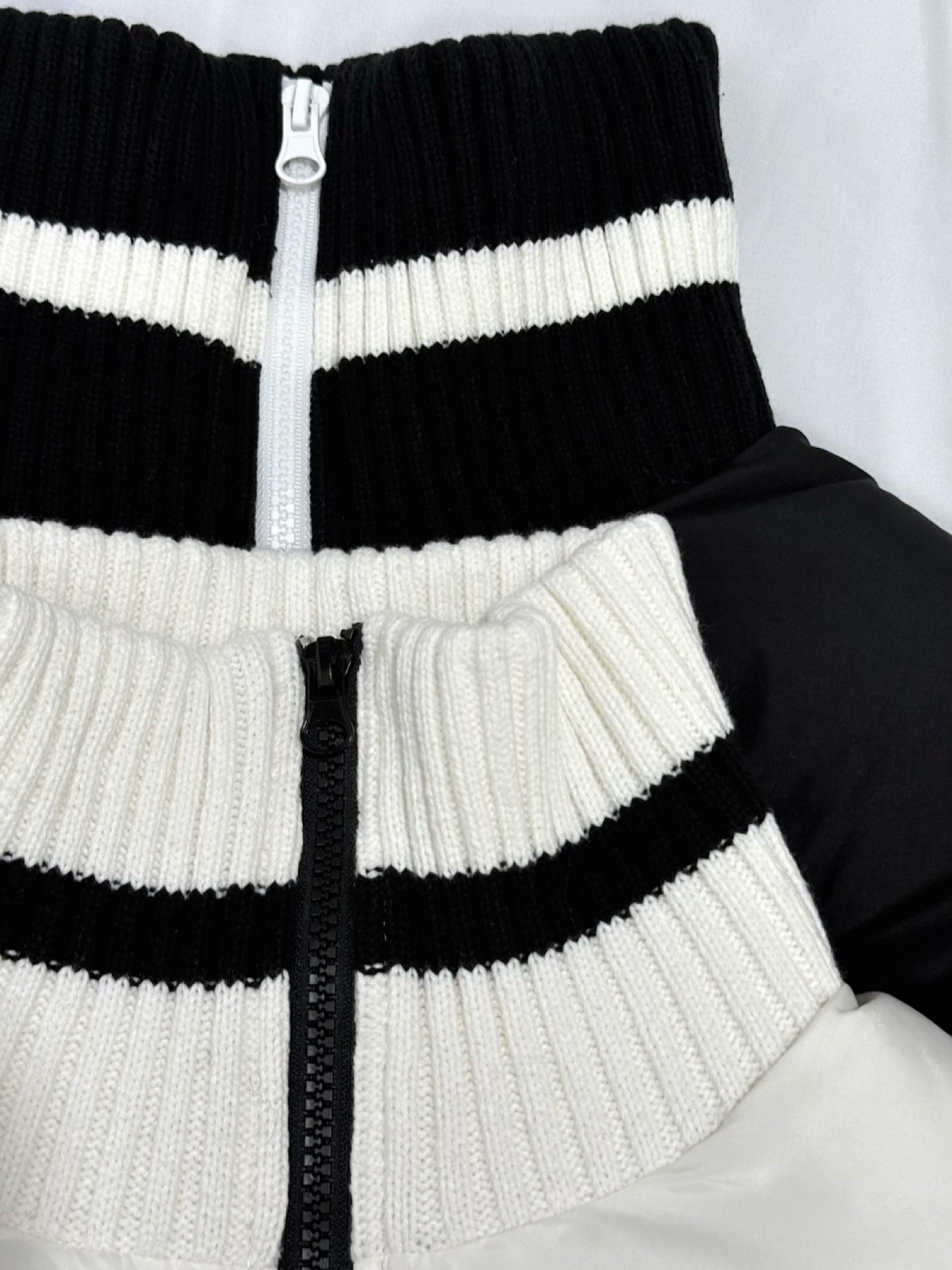 Accent color knit docking puffy blouson
