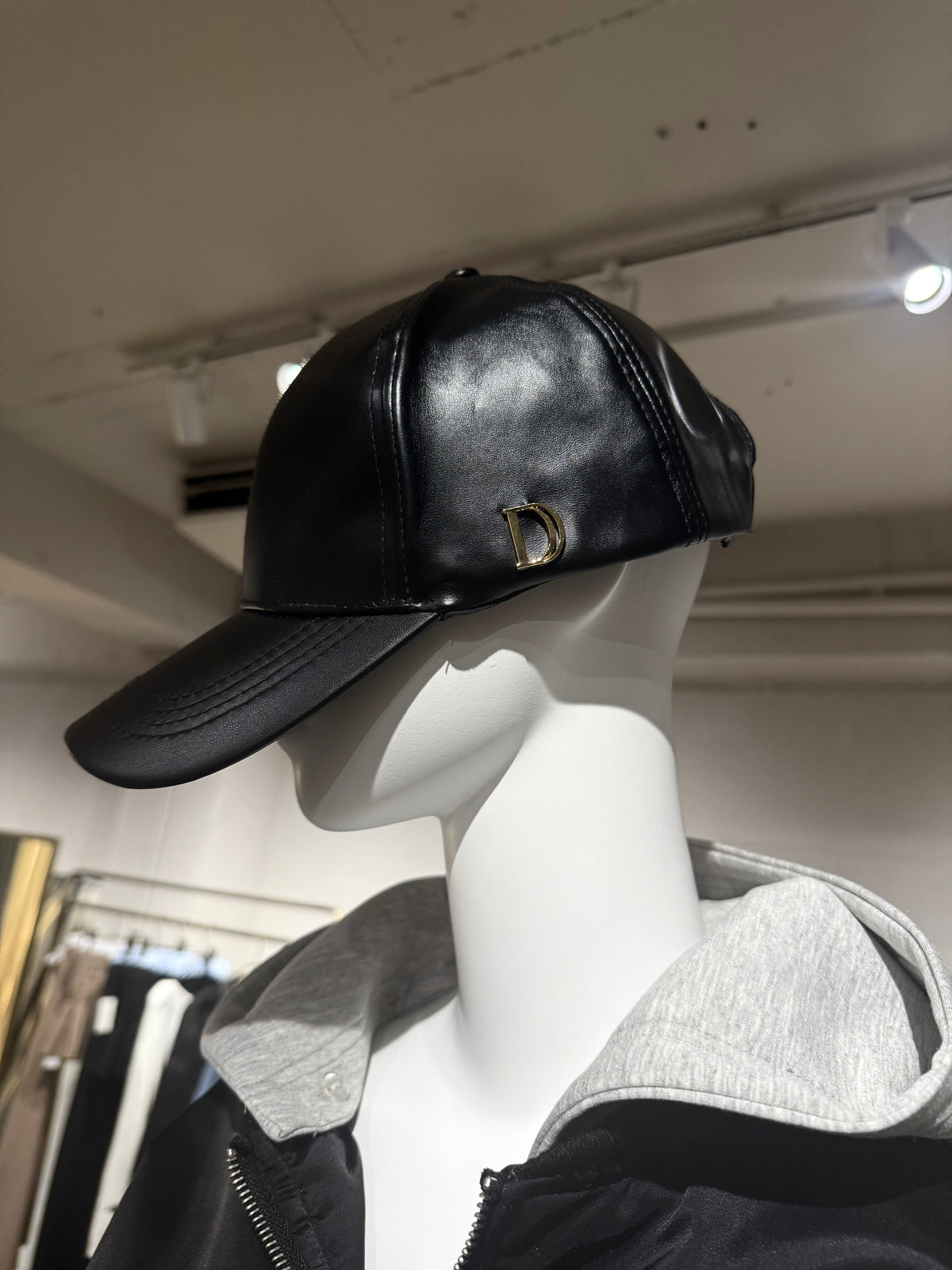 Accent charm leather cap