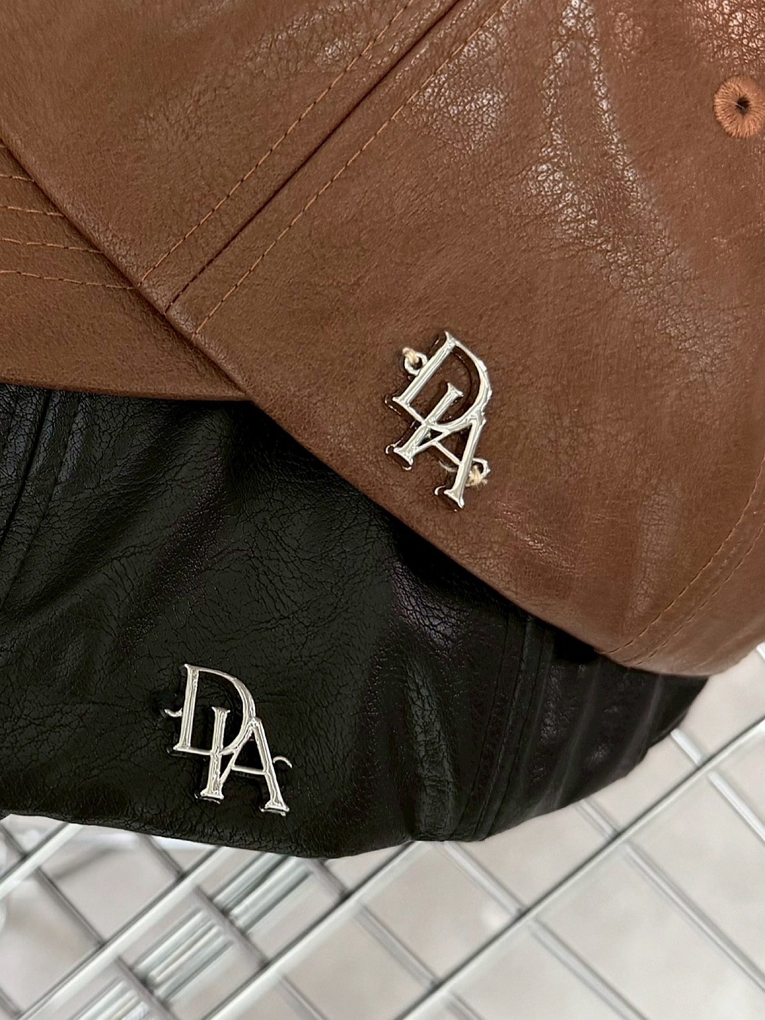 Initial logo leather cap