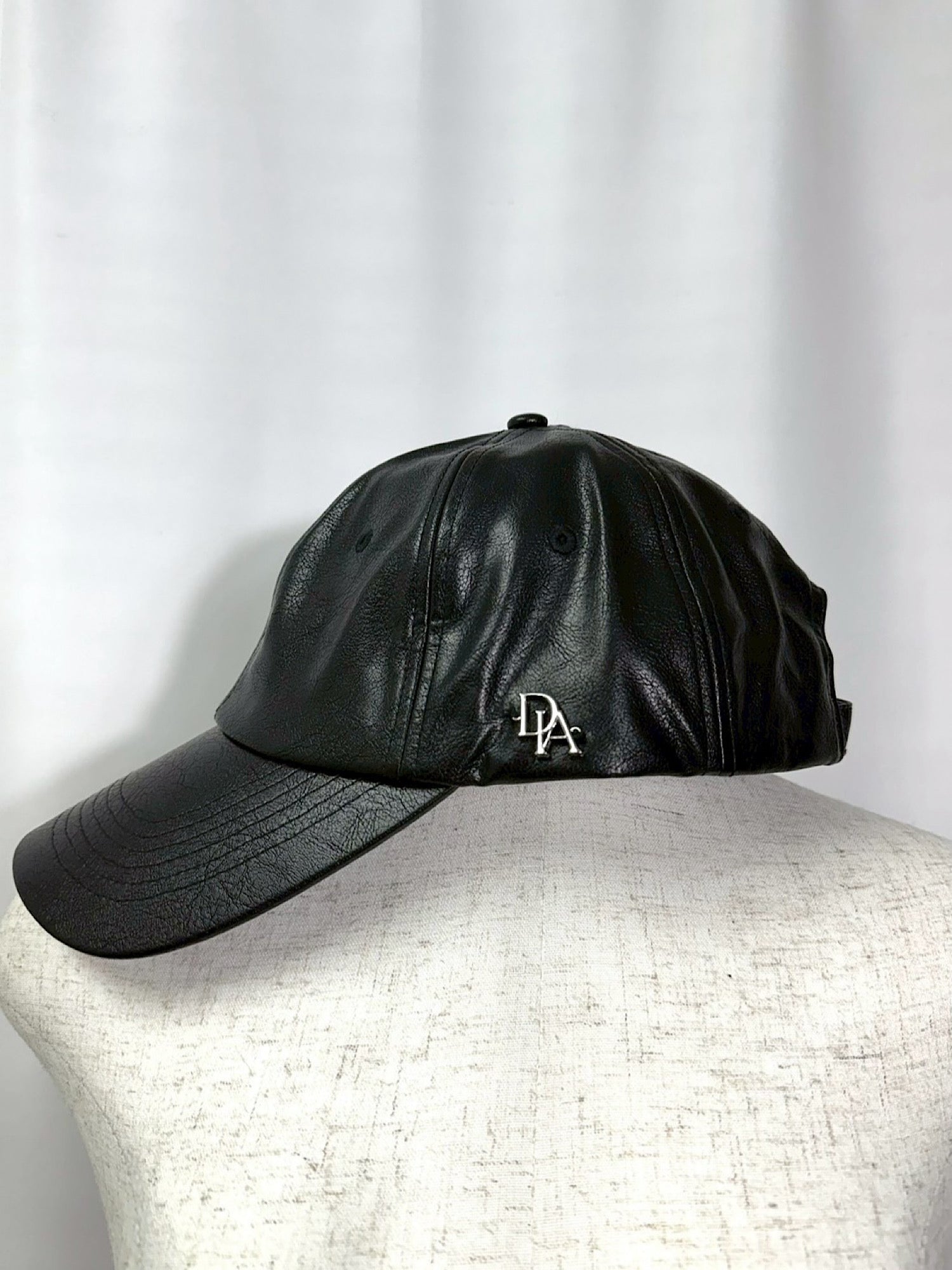 Initial logo leather cap