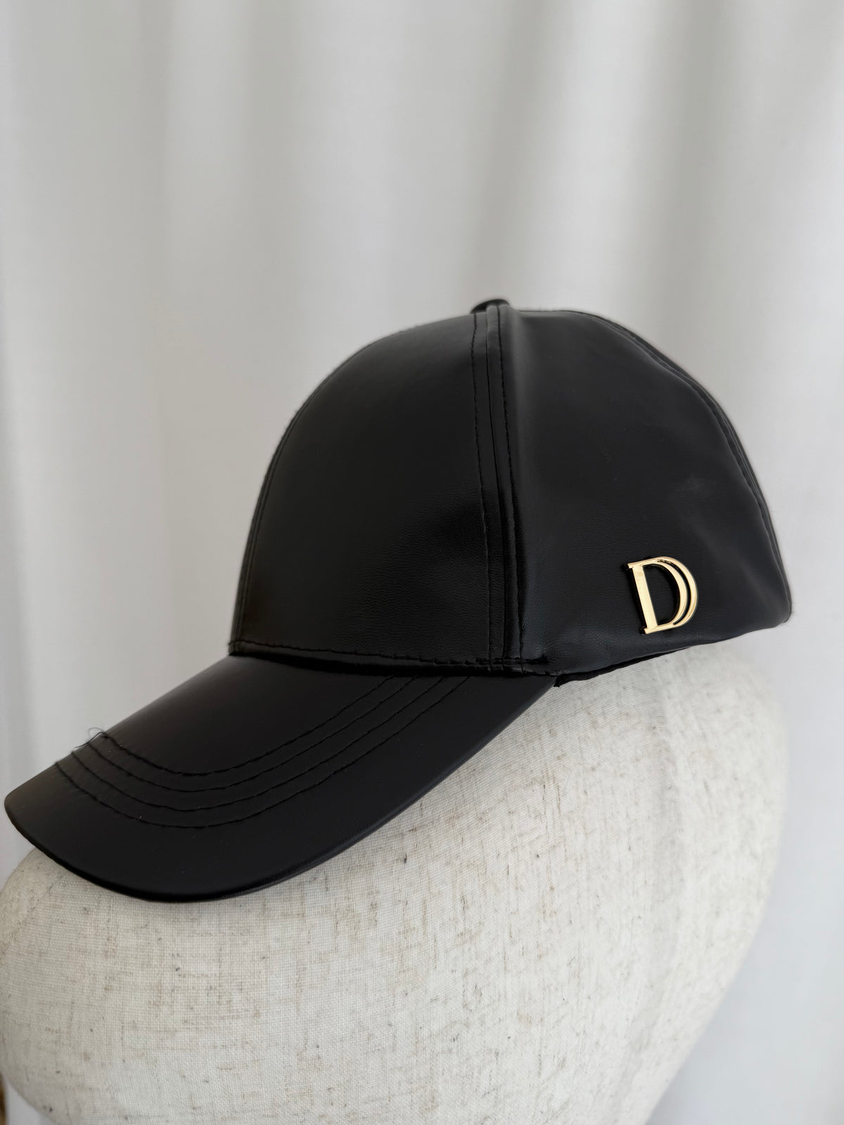 Accent charm leather cap