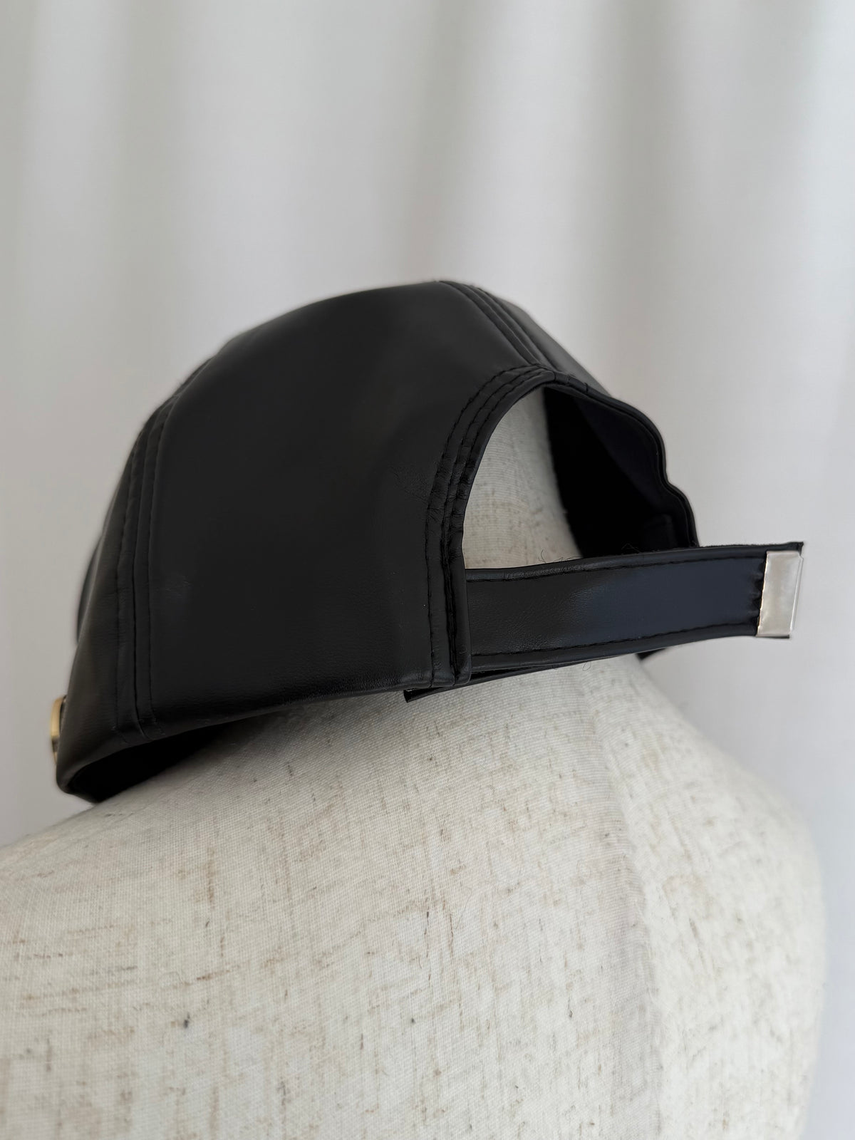 Accent charm leather cap