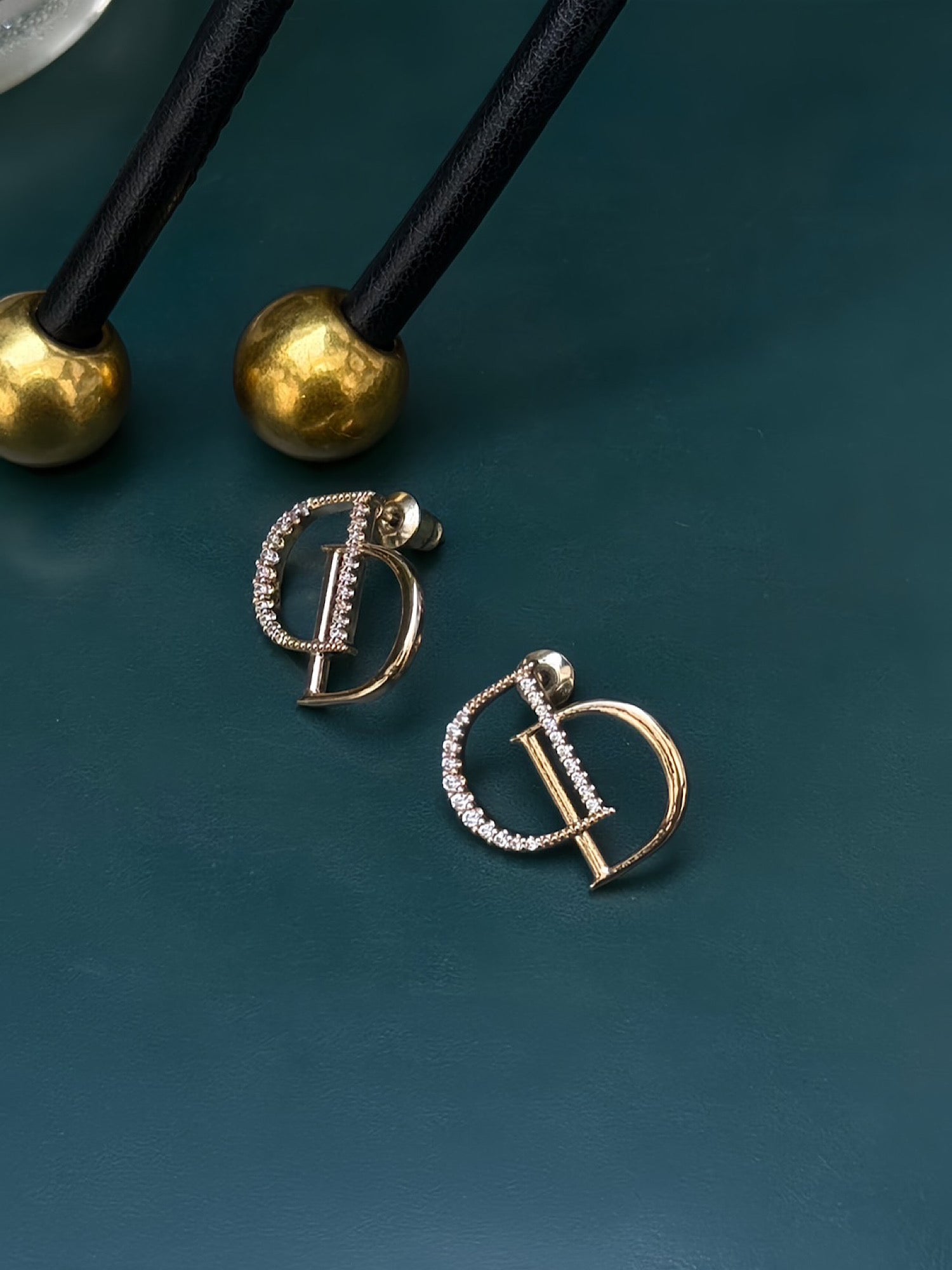 DD logo pierced earrings